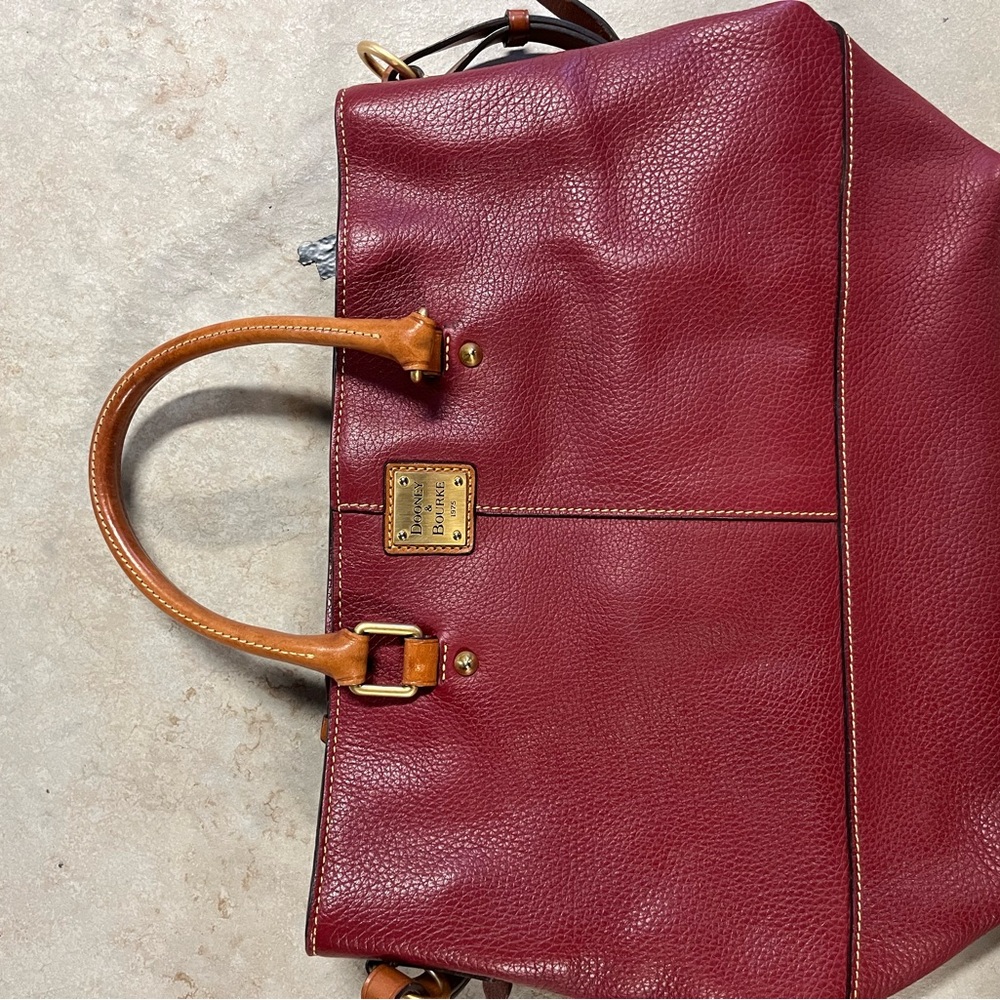 Red leather tote bag.
